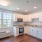 a kitchen with white cabinets