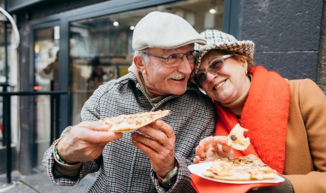 Find your perfect fit at Serenity at Brewster a couple eating pizza