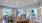 a clubroom kitchen with tables and chairs