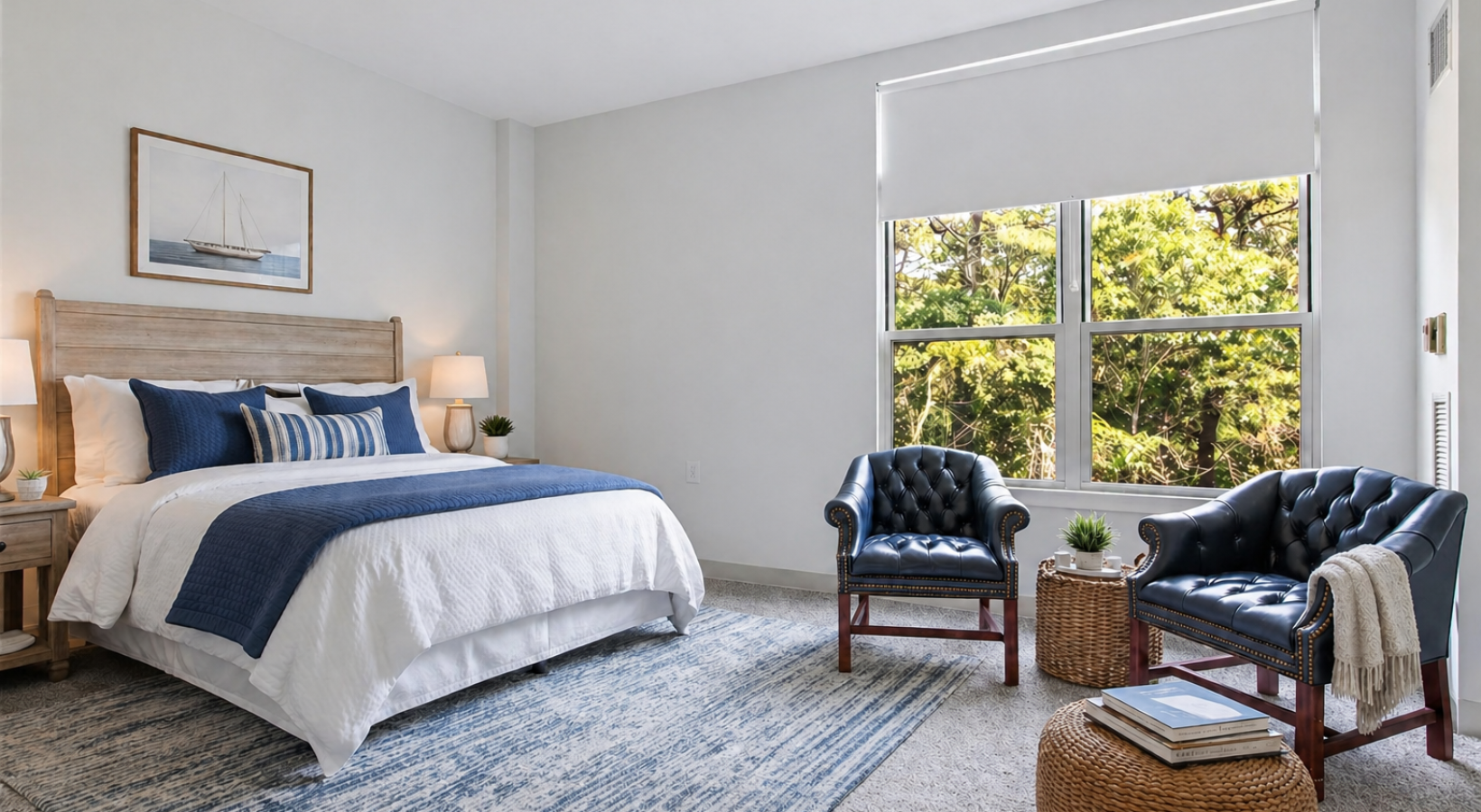 a bedroom with a bed and chairs
