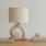 a lamp, stack of books, and decor
