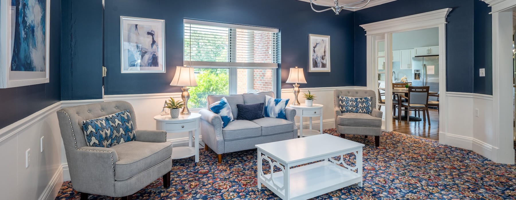 a clubroom with a couch and chairs