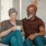smiling, older couple, sit together on a couch
