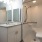 a bathroom with a shower and sink